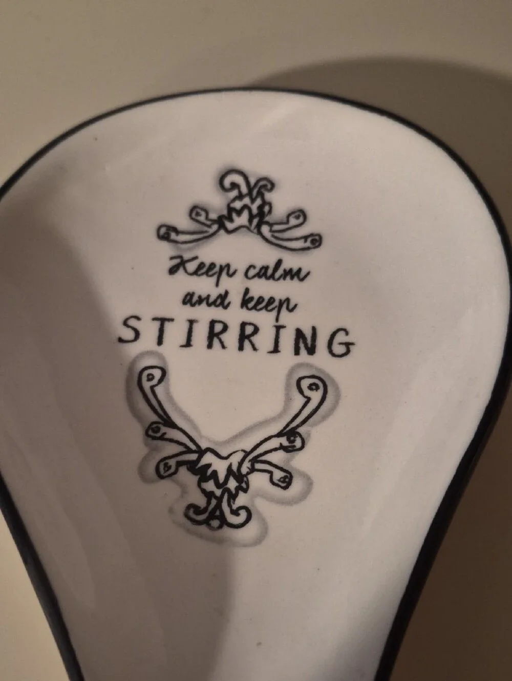 Keep Calm and Keep Stirring Ceramic Spoon Rest - White with Black Trim